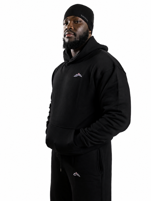 MÒN The Summit Hoodie in black, oversized fit, front lifestyle view