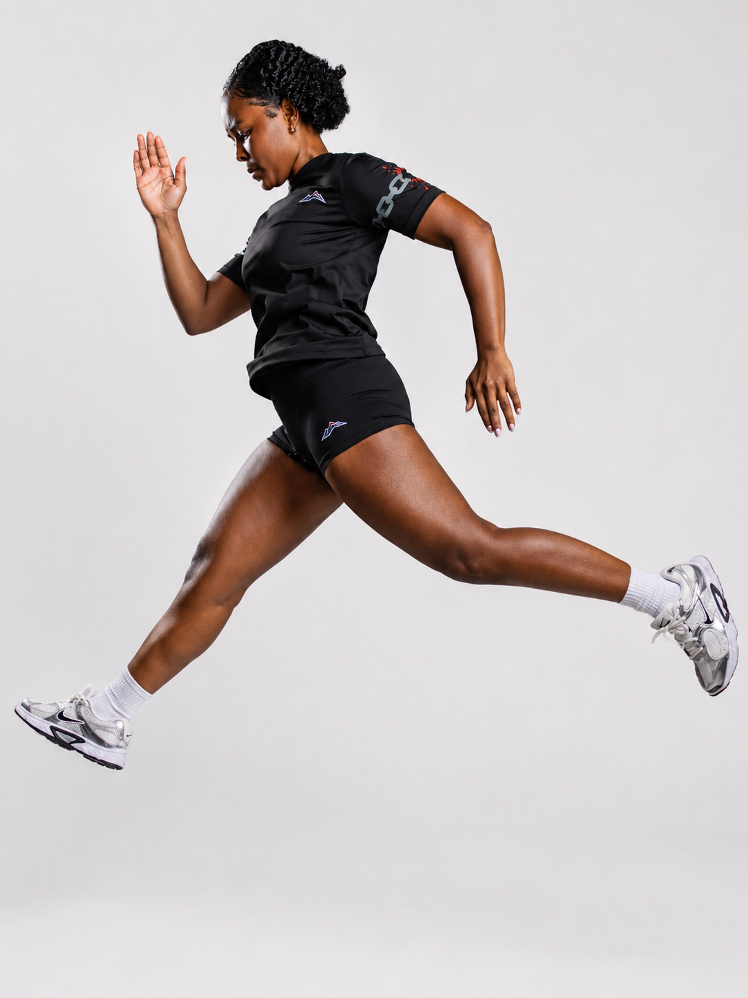 MÒN The Core Shorts in black, lifestyle action shot during training