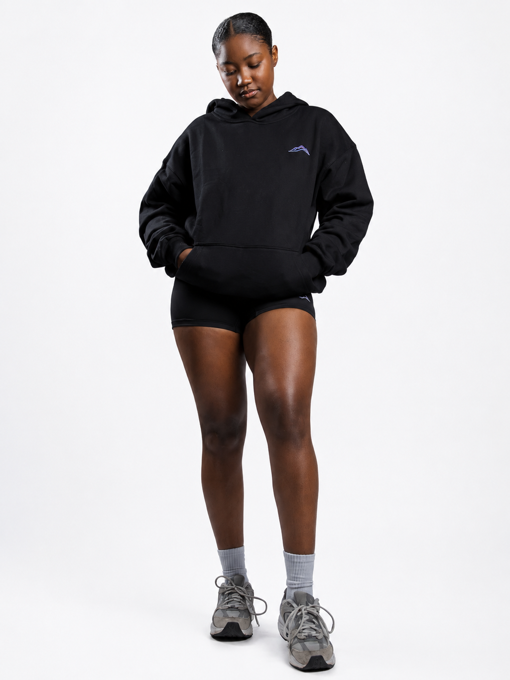 MÒN The Summit Hoodie in black, full-body front lifestyle view