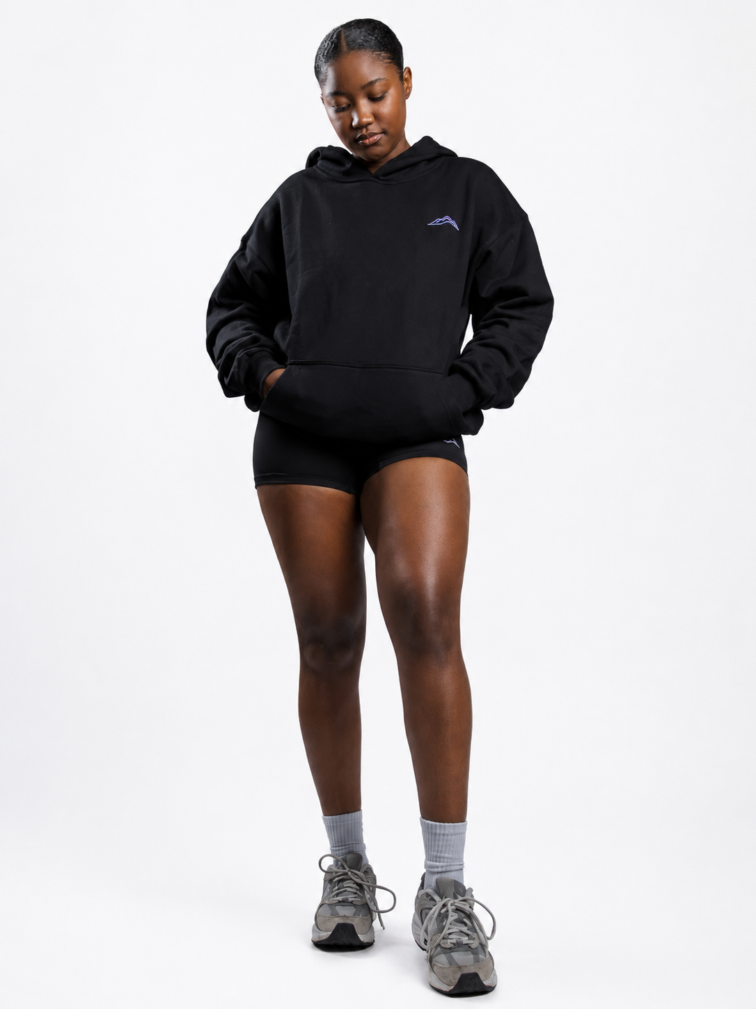 MÒN The Summit Hoodie in black, full-body front lifestyle view